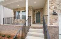 ***Photo taken from a previously built Aspire home with Basement***  Enjoy morning coffee on your covered front porch!