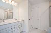 ***Photo taken from a previously built Aspire home with Basement***  We have also included tile flooring and dual sinks with quartz countertops in the Owner's Bathroom.