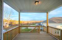 ***Photo taken from a recently completed Hampton home in the community***  Enjoy the elevated treelined views from the Rear Covered Deck.