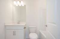 ***Photo taken from a recently completed Hampton home in the community***  A full Bathroom is included in the Basement.