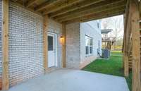 ***Photo taken from a recently completed Hampton home in the community***  The Walk-out Basement allows easy access to the backyard. Enjoy this Covered Patio all-year round!