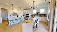 ***Photo taken from the Furman model home in Durham Farms***  Located right off of the Kitchen is the Dining area, which is designed to comfortably fit a 6-person table.