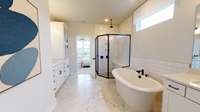 ***Photo taken from the Furman model home in Durham Farms***  This shows a reverse angle of the Owner's Bathroom so that you can get a better feel for the layout of the freestanding tub and shower.