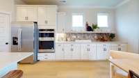 ***Photo taken from the Furman model home in Durham Farms***  We have added the additional cabinetry in the Dining area, providing you with plenty of storage four your gourmet Kitchen.