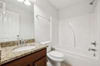 Full bathroom located in the hallway upstairs