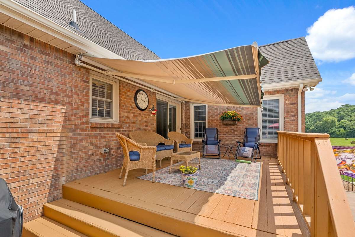 Deck coming off the breakfast nook area inside with retractable Sunsetter awning