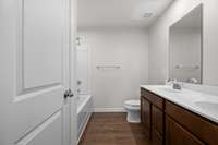Double vanity in owner's bath