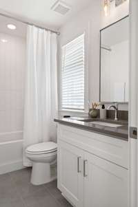 Guest Bathroom - Photos are of similar home and selections to vary.