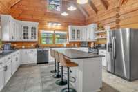 Large 8 ft kitchen island with breakfast bar.