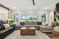 The living room boasts huge glass doors that open to an incredible outdoor entertaining space!   8385 Lascassas Pike Lascassas, TN 37085