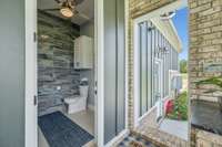 Conveniently located nearby is a half bathroom with a pedestal sink that offers additional storage and makes outdoor entertaining effortless.  8385 Lascassas Pike Lascassas, TN 37085