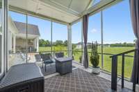 This screened-in patio off of the primary suite boasts vaulted ceilings and a ceiling fan, creating a comfortable space to relax year-round. 8385 Lascassas Pike Lascassas, TN 37085