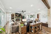 An open concept layout flows seamlessly into the kitchen, highlighted by a striking wood beam at the entrance that adds a touch of architectural charm. 8385 Lascassas Pike Lascassas, TN 37085