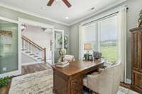 Glass French doors with textured panels open into a bright room with floor-to-ceiling windows that flood the space with natural light! 8385 Lascassas Pike Lascassas, TN 37085