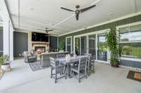 Glass sliding doors seamlessly connect the outdoor area to the living room and kitchen.  8385 Lascassas Pike Lascassas, TN 37085