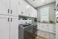 This oversized laundry room features a full sink, ceiling fan, and an abundance of cabinet storage for ultimate functionality and style! 8385 Lascassas Pike Lascassas, TN 37085