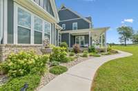The sidewalk wraps around to the garage and paved parking pad for added convenience and curb appeal. 8385 Lascassas Pike Lascassas, TN 37085