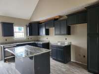 Large Island with Granite Countertop provides Extra Space for Serving and Entertaining! Picture of Previous House.