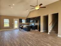 Spacious Living Room is open to the Kitchen and Dining Room. Picture of Previous House.