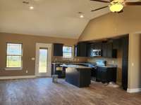Kitchen features Custom Cabinets and Granite Counter Tops. Picture of Previous House.