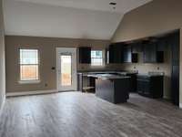 Spacious Kitchen with Large Island and Dining Area. Picture of Previous House.