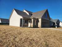 Wonderful New Home with Covered Front Porch for welcoming Friends & Family! Picture of Previous House.