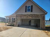 Large 2 Car Garage and Double Wide Driveway. Picture of Previous House.