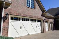 Freshly painted garage doors and light fixtures