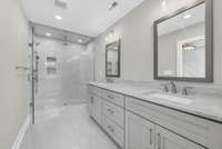 Primary bathroom features granite countertops and tile shower with separate water closet