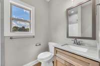 Full Bathroom downstairs offers convenience and comfort for guests