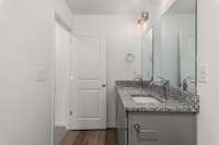 Guest bathroom also features double vanities!