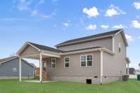 When not enjoying your covered front porch, relax on your covered back patio!