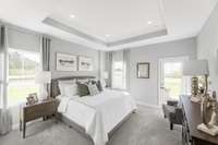 Primary bedroom with optional patio door and optional tray ceiling