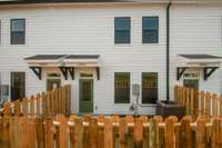 A peek into the private backyard, framed by a handsome wooden fence—your own quiet retreat awaits.