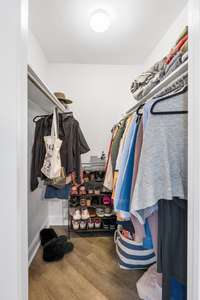 Primary bedroom walk-in closet