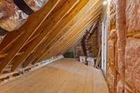 This is the floored attic area on the second level. It is very convenient for storage of your things. There is no lack of space in this home for storage.
