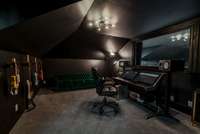 A professional-grade music studio mastering room, thoughtfully designed for exceptional acoustics and creativity — easily adaptable as a quiet home office, podcast studio, or hobby space to suit any passion.