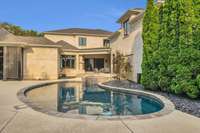 The custom-designed inground pool stands as the centerpiece of the backyard, featuring elegant lines and luxurious finishes — a private oasis crafted for both relaxation and sophisticated entertaining.