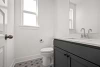 Large half bath on main level.