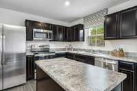 The kitchen comes with an optional island, a pantry, and all appliances are INCLUDED!