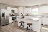 The kitchen features a large size island with a pantry and all appliances are included!