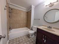 Upstairs full bath with Shower/Tub combo, Corian countertop vanity...