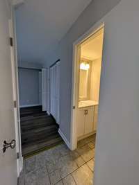Back cross-hallway with half bath and pantry...