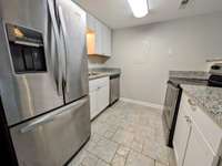 Stainless steel appliances with updated cabinetry...