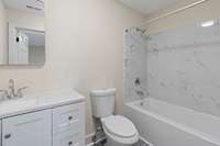 This one has an attached bath! An elegant surround frames the shower.