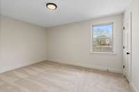Two more spacious bedrooms are located on the main level.