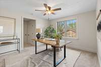 A gorgeous home office is located near the primary bedroom.