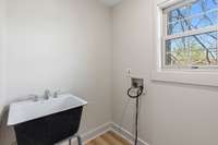 The laundry room includes a convenient utility sink.