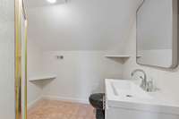 The fourth full bath can be accessed from the hall.