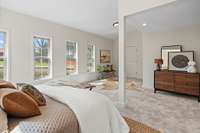 Many windows and high ceilings make the room feel airy and bright.